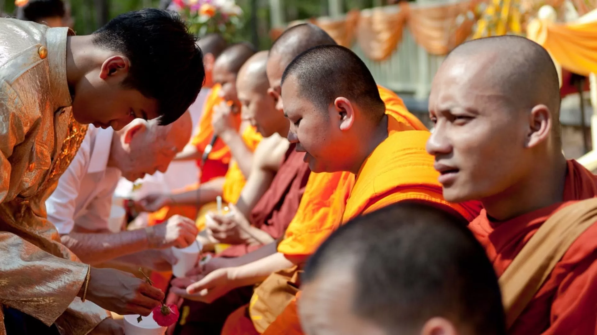 Offering alms to monks