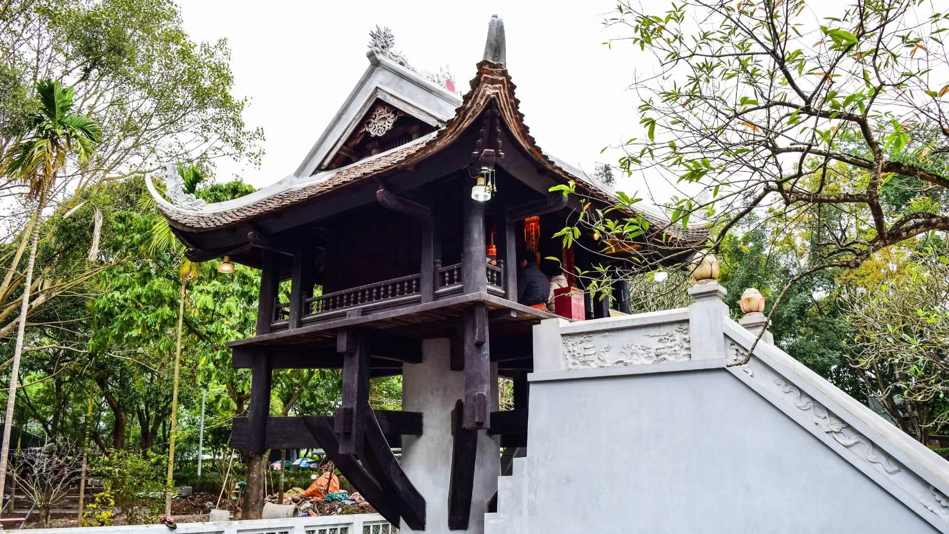 Delicate pagoda perched on a pillar, shaped like a blooming lotus.
