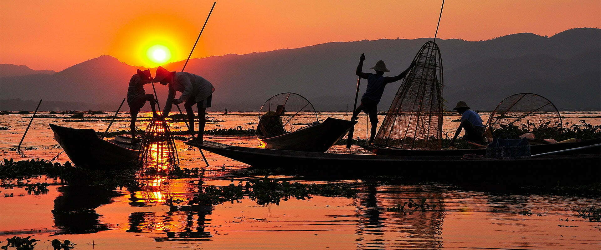 mandalay Birmanie pêche au couché du soleil